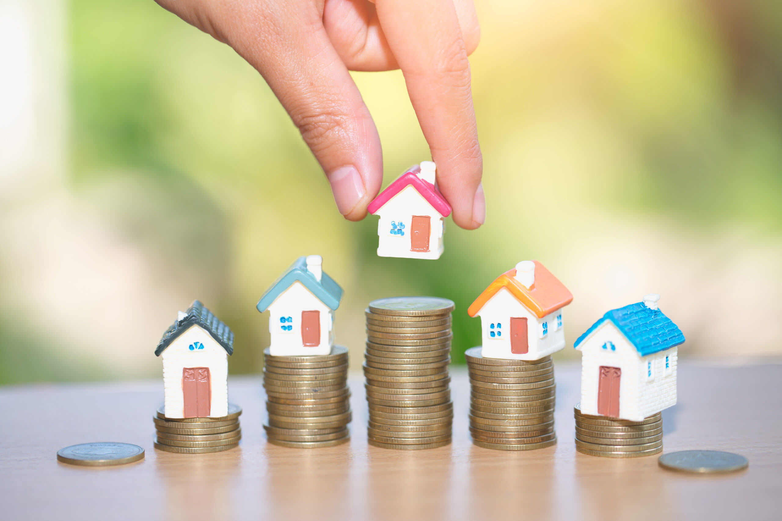Mini house on stack of coins, Real estate investment, Save money tiny houses and coins