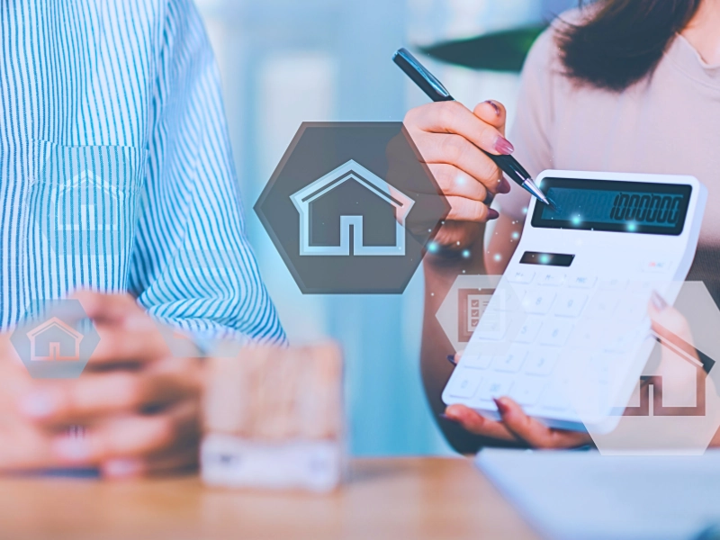 Blog 4 Person using calculator during real estate financial planning consultation meeting.
