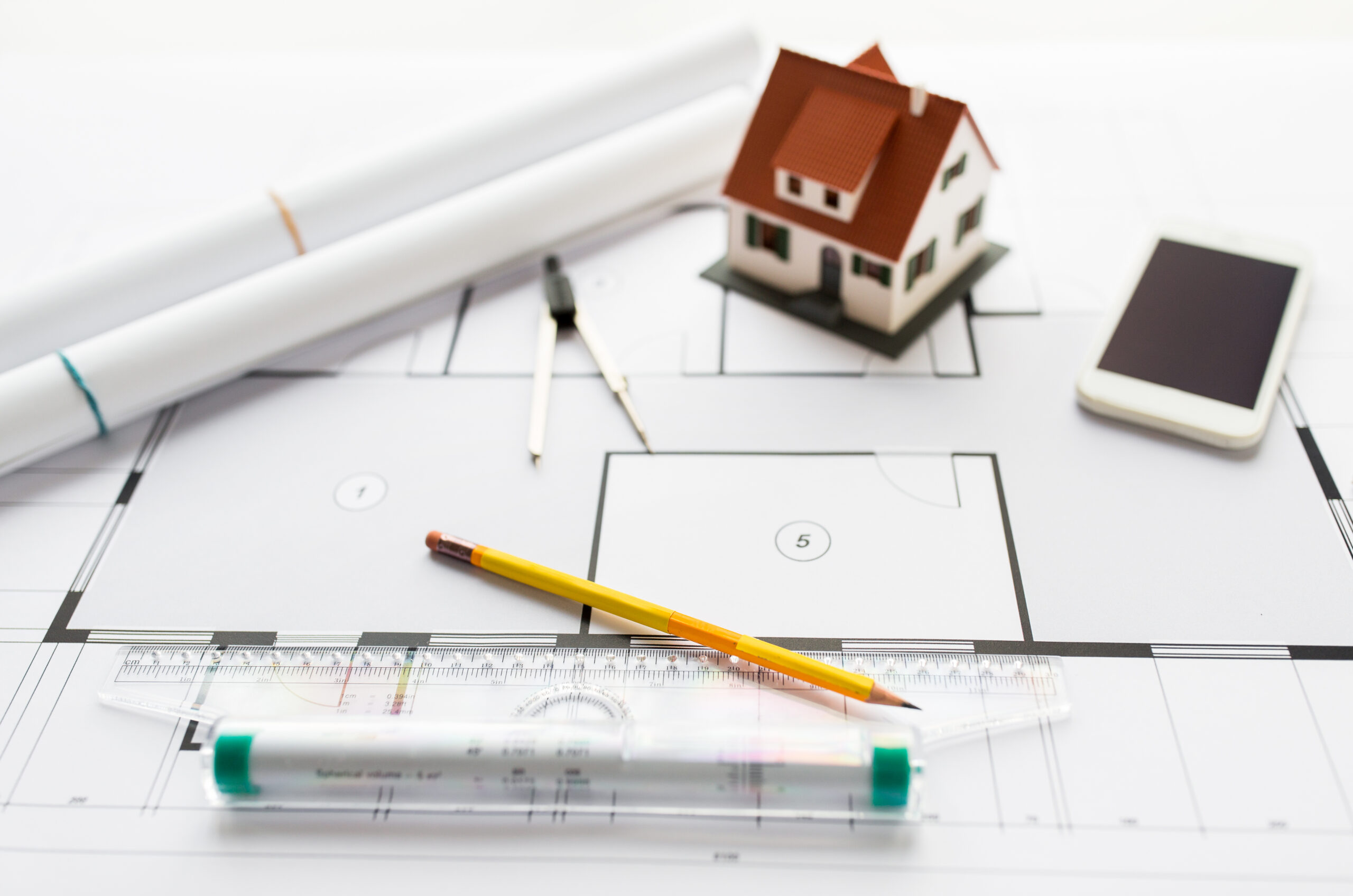close up of architectural blueprint and tools Rental Real Estate Appraisal in Tampa Bay